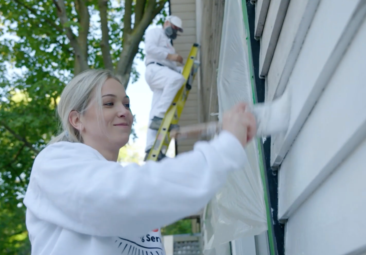 Painters in multi-colour overalls